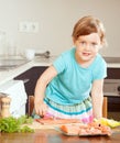 Baby girl with raw salmon fish Royalty Free Stock Photo