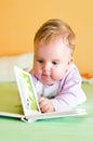 Baby girl reading Royalty Free Stock Photo