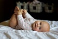 Baby Girl Relaxing and Playing with Her Toes Royalty Free Stock Photo