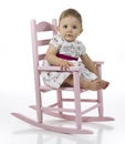 Baby girl in rocking chair Royalty Free Stock Photo