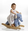 Baby girl on rocking elephant