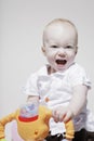 Baby girl on rocking horse Royalty Free Stock Photo