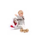 Baby girl and Santa`s hat with christmas ornament Royalty Free Stock Photo
