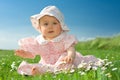 Baby girl sat in flowery field