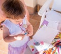 Baby girl sharpening pencil Royalty Free Stock Photo