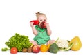 Baby girl sitting surrounded by fruits and vegetables, isolated on white Royalty Free Stock Photo