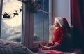 Baby girl sitting by the window Royalty Free Stock Photo