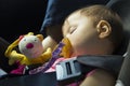 Baby girl sleeping in the child car seat Royalty Free Stock Photo