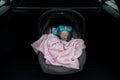 Baby girl sleeping in a safety child car seat. 3 months old baby girl. Protection concept, safety, and security Royalty Free Stock Photo