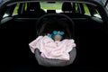 Baby girl sleeping in a safety child car seat. 3 months old baby girl. Protection concept, safety, and security Royalty Free Stock Photo