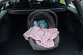 Baby girl sleeping in a safety child car seat. 3 months old baby girl. Protection concept, safety, and security Royalty Free Stock Photo