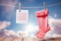 Baby girl socks on a rope, with an attached blank card Royalty Free Stock Photo