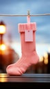 Baby girl socks on a rope, with an attached blank card