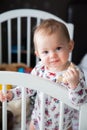 Baby girl standing in her bed Royalty Free Stock Photo