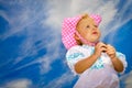Baby girl standing with serious face Royalty Free Stock Photo
