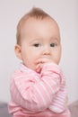 Baby girl sucking her fingers Royalty Free Stock Photo