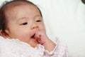 Baby girl sucking her fingers Royalty Free Stock Photo