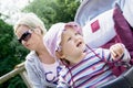 Baby girl in the sun hat with her young mother Royalty Free Stock Photo