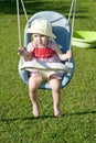 Baby girl on swing Royalty Free Stock Photo