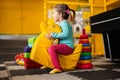 Baby girl swings on yellow paralon duck at kindergarten Royalty Free Stock Photo