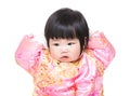 Baby girl touching head with traditional chinese costume Royalty Free Stock Photo
