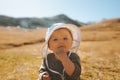 Baby girl traveling in mountains family active lifestyle