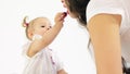 Smudged baby girl treats her mom with berries