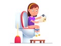 Baby girl using toilet sink tearing wiping paper Royalty Free Stock Photo