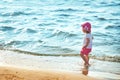 Baby girl is walking on the beach Royalty Free Stock Photo