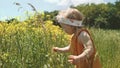 Baby girl walking in grass field child playing Royalty Free Stock Photo