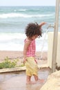 Baby girl washing his feet Royalty Free Stock Photo