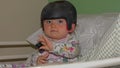 Baby girl wearing a cranial remoulding helmet flat head