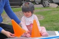 Baby girl wearing a cranial remoulding helmet flat head