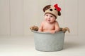 Baby Girl Wearing a Crocheted Puppy Dog Hat