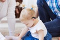 Baby girl wearing a hearing aid. Disabled child, disability and deafness concept. Royalty Free Stock Photo