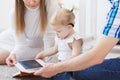 Baby girl wearing a hearing aid. Disabled child, disability and deafness concept.