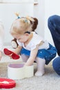 Baby girl wearing a hearing aid. Disabled child, disability and deafness concept. Royalty Free Stock Photo