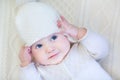 Baby girl wearing knitted sweater and hat Royalty Free Stock Photo