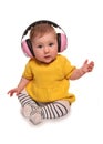 Baby girl wearing pink ear defenders