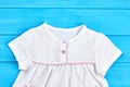 Baby-girl white cotton clothing close up. Royalty Free Stock Photo