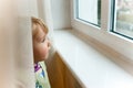 Baby girl at window