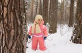 Baby girl in the winter forest