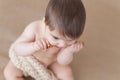 Baby girl with a wooden honey spoon - high angle Royalty Free Stock Photo