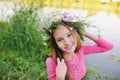 Baby girl in a wreath of wildflowers