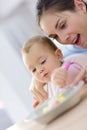 Baby girl wth her mother eating lunch Royalty Free Stock Photo