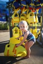 Baby Girld By the Pool Putting on Life Jacket Royalty Free Stock Photo