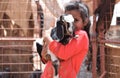 Wadi Rum Desert, Jordan. May 12 2022. Cute little Jordanian Bedouin girl holding a baby goat Royalty Free Stock Photo