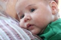 Baby on grandmother's shoulder