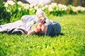 Baby in green grass of tulip field at springtime Royalty Free Stock Photo