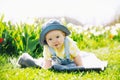 Baby in green grass of tulip field at springtime Royalty Free Stock Photo